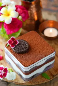 A dessert with a cookie on top

Description automatically generated