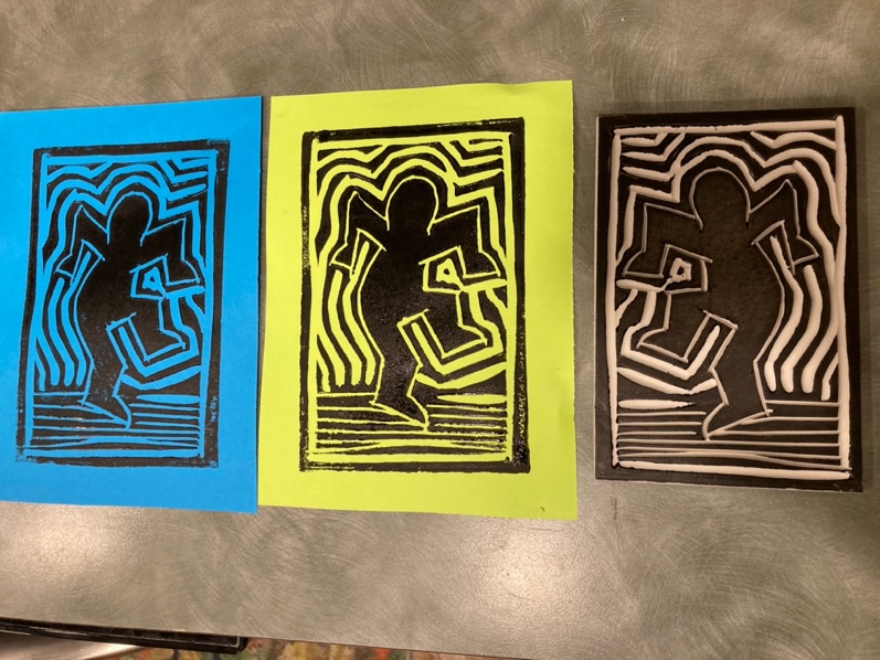 A group of art pieces on a table

Description automatically generated